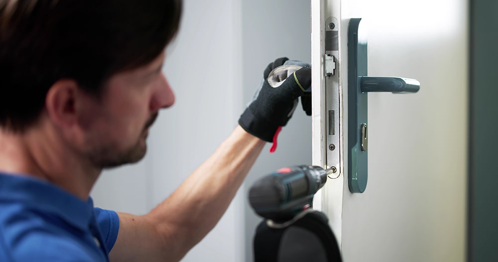 locksmith inspecting lock